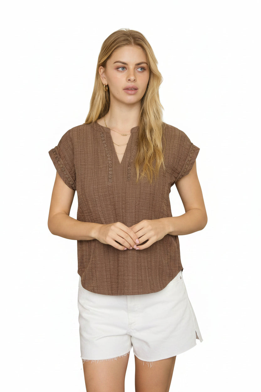 Brown textured blouse with split neckline, short sleeves, and lace detail accents