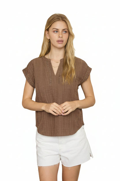 Brown textured blouse with split neckline, short sleeves, and lace detail accents