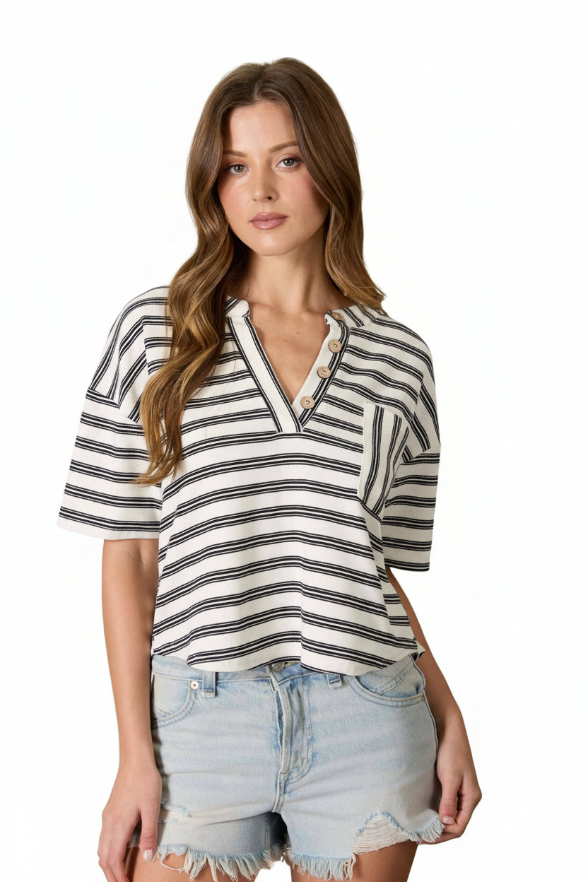 Black and ivory striped henley top with short sleeves, pocket detail, and relaxed boxy fit