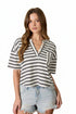 Black and ivory striped henley top with short sleeves, pocket detail, and relaxed boxy fit