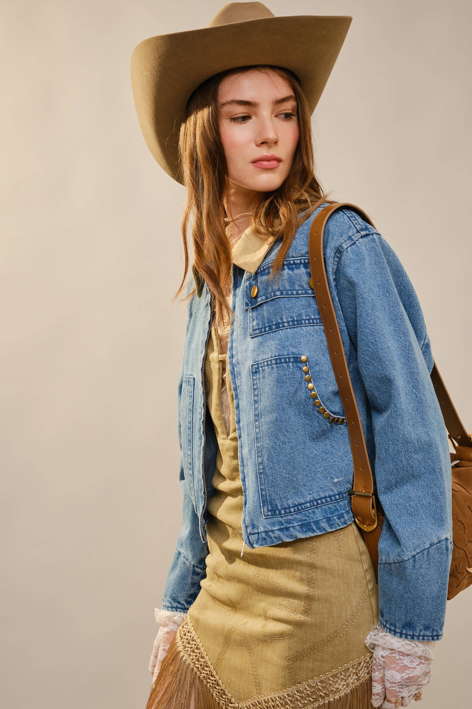 Cropped western denim jacket with contrast collar and antique gold stud details on front pockets