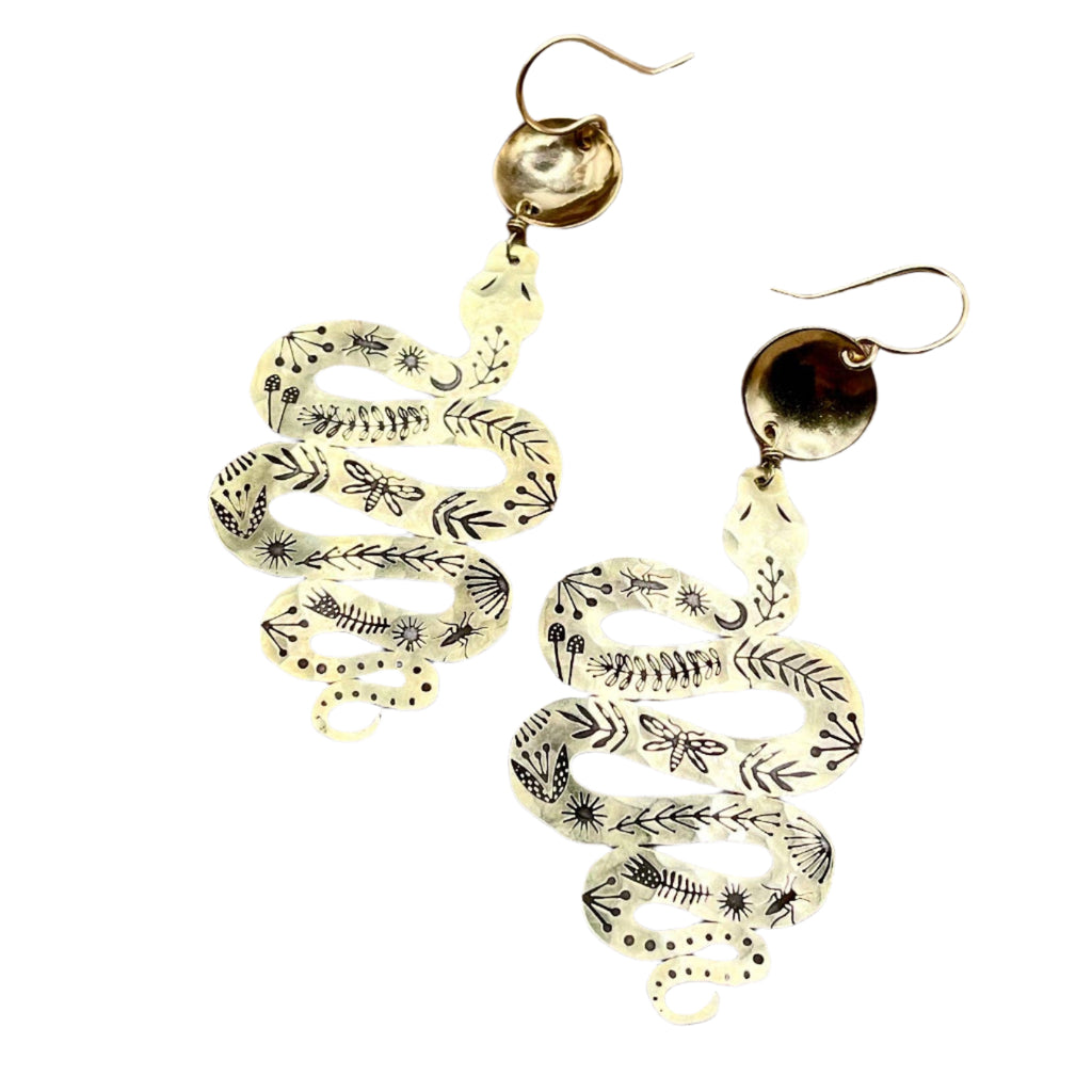 Handmade Western Rattler Earrings featuring intricately stamped brass snake pendants with nature-inspired detailing, hanging from hypoallergenic 14k gold-filled ear wires.