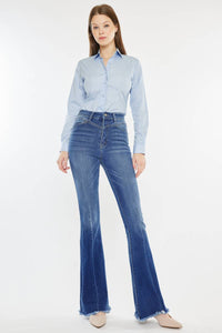 Western Wanderer Flare – High-rise flare jeans with a frayed hem, medium stone wash, and stretch denim. Features front yoke seam, front seam line, and a flattering silhouette with an 11" rise and 33.5" inseam.