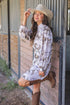 Women’s western horse print long sleeve shirt dress in sand with collared neckline and button front