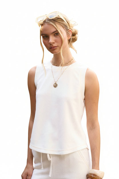 White ribbed sleeveless knit tank top with round neckline and back button split detail